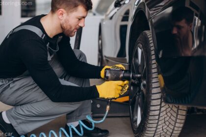 Portable air pump for car tires plugged into a vehicle's 12V socket in winter