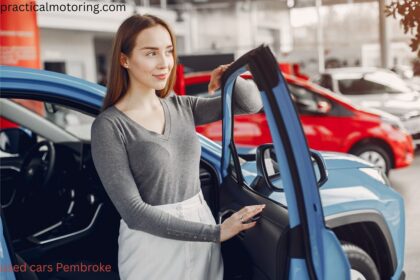 Used cars Pembroke dealership lot with sedans, trucks, and SUVs for sale