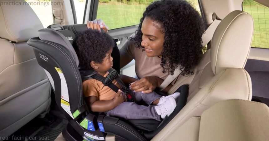 Smiling Canadian parent securely fastening a rear facing car seat with an infant inside a vehicle.