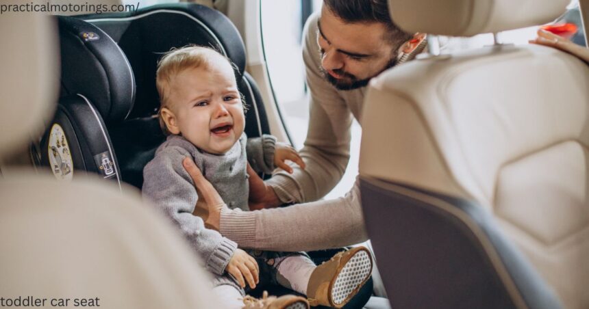 Toddler car seat installed in the back seat of a car in Canada