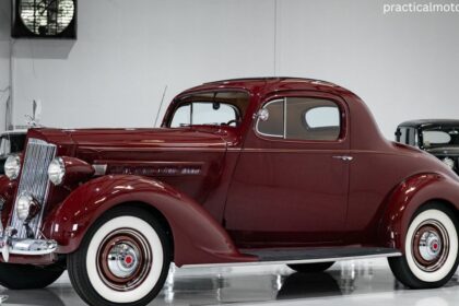Close-up of a Packard Cars chrome grille and headlights.